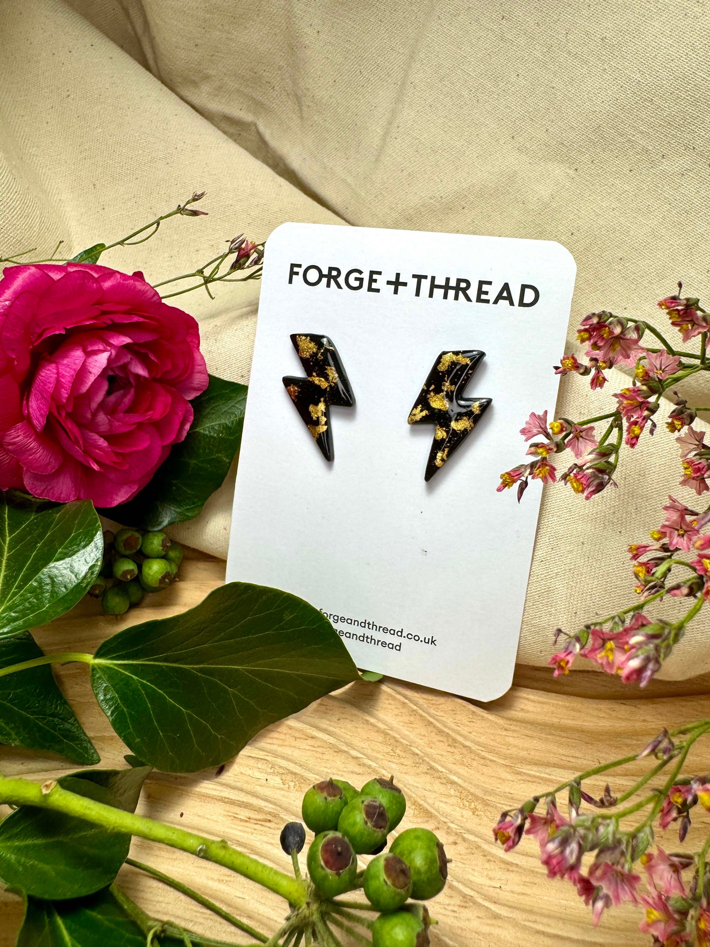 BLACK & GOLD LIGHTNING STUDS